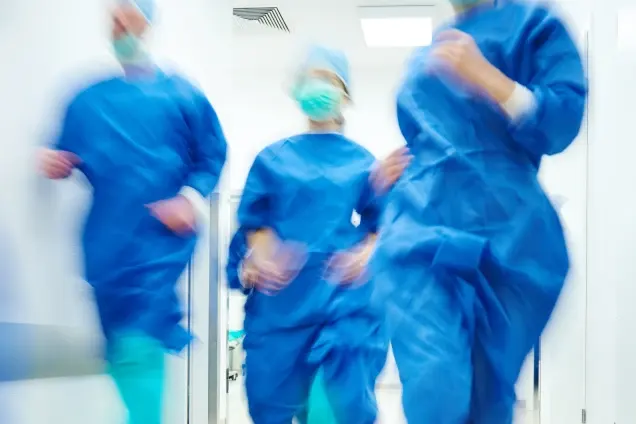 Surgical nurses rushing to an emergency